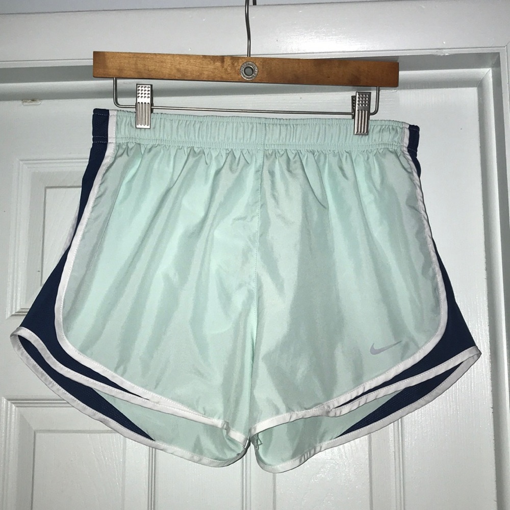 light green, dark blue, and white nike shorts